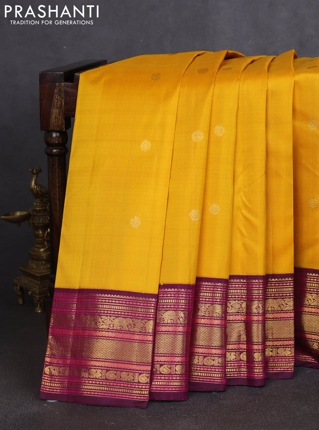 Pure kanchipuram silk saree mango yellow and dark magenta pink with zari woven buttas and rich zari woven border