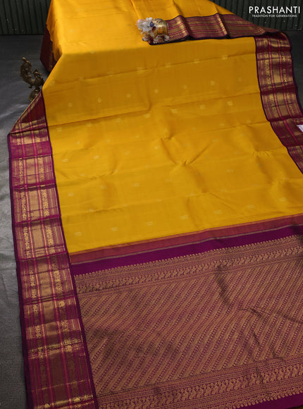 Pure kanchipuram silk saree mango yellow and dark magenta pink with zari woven buttas and rich zari woven border