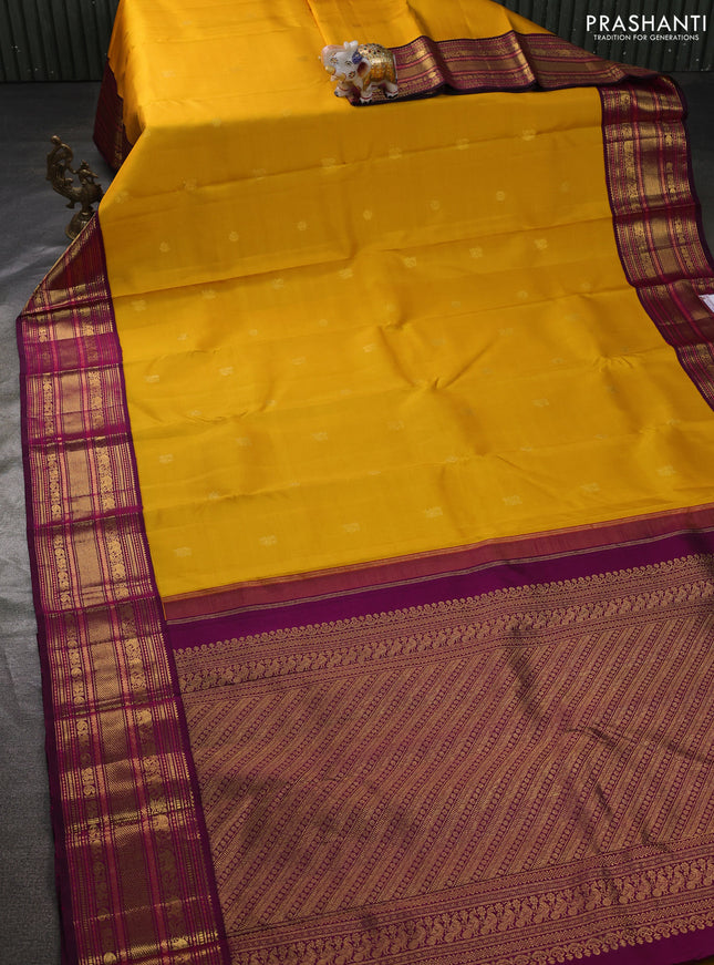 Pure kanchipuram silk saree mango yellow and dark magenta pink with zari woven buttas and rich zari woven border