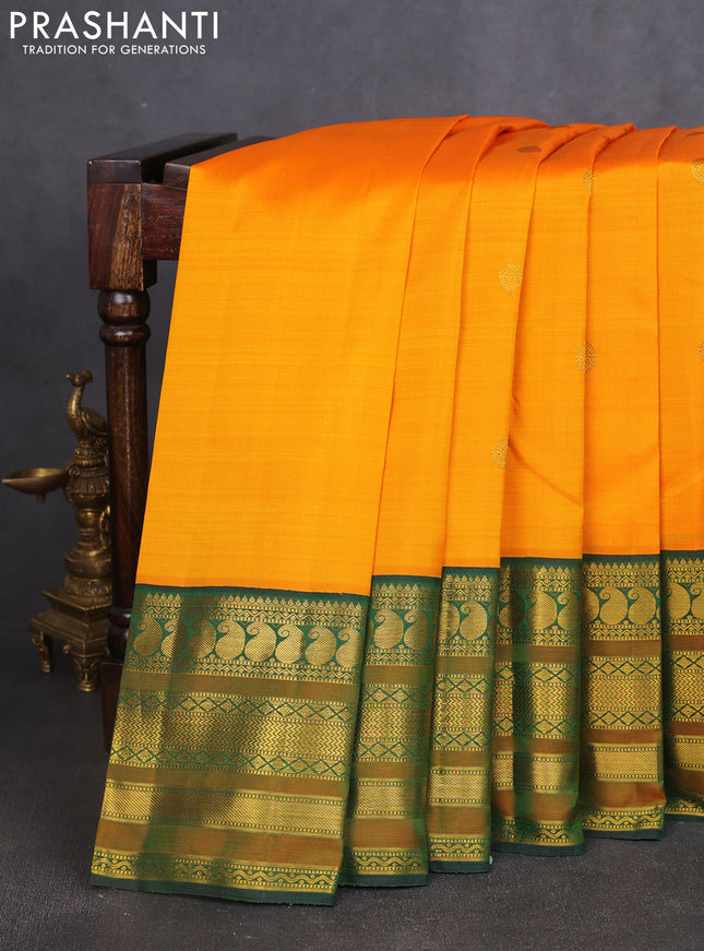 Pure kanchipuram silk saree mango yellow and bottle green with zari woven buttas and long rich zari woven korvai border