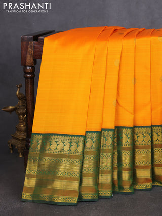 Pure kanchipuram silk saree mango yellow and bottle green with zari woven buttas and long rich zari woven korvai border