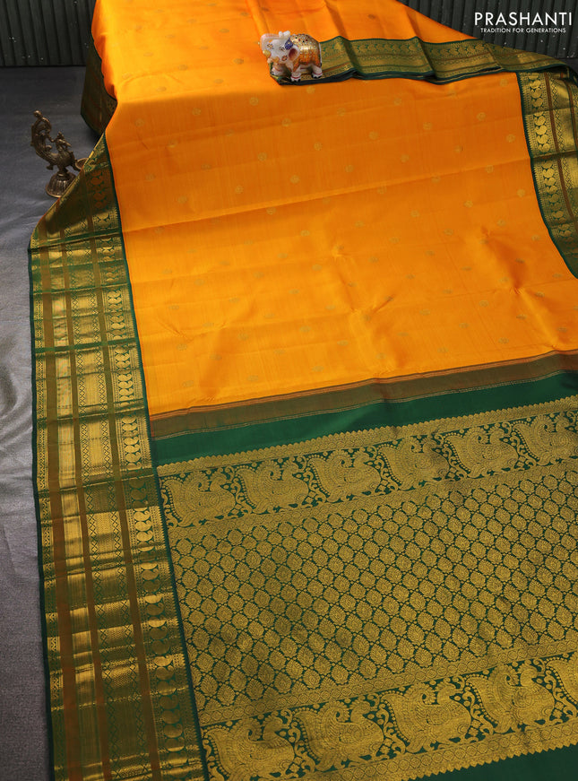 Pure kanchipuram silk saree mango yellow and bottle green with zari woven buttas and long rich zari woven korvai border