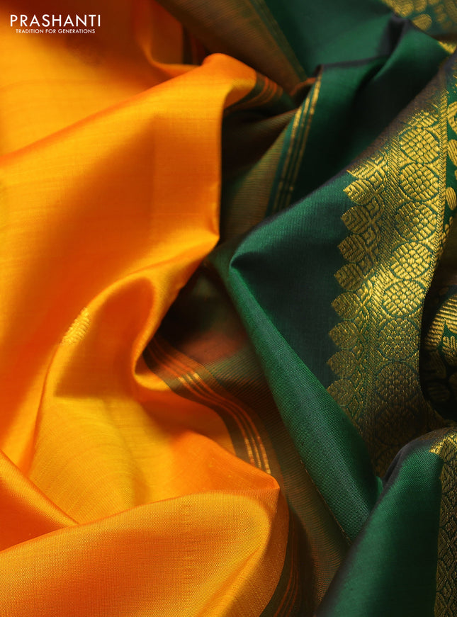 Pure kanchipuram silk saree mango yellow and bottle green with zari woven buttas and long rich zari woven korvai border