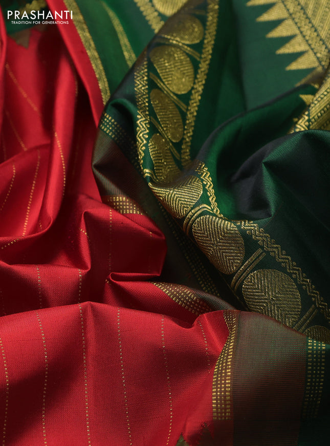 Pure kanchipuram silk saree red and dark green with allover zari stripe pattern and long rettapet zari woven border
