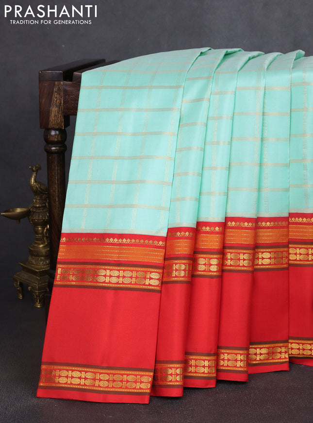 Pure kanchipuram silk saree teal blue and red with allover zari woven checked pattern and long rettapet zari woven border