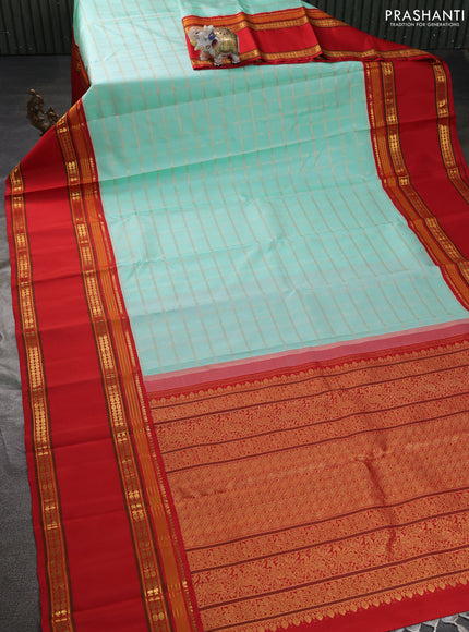 Pure kanchipuram silk saree teal blue and red with allover zari woven checked pattern and long rettapet zari woven border