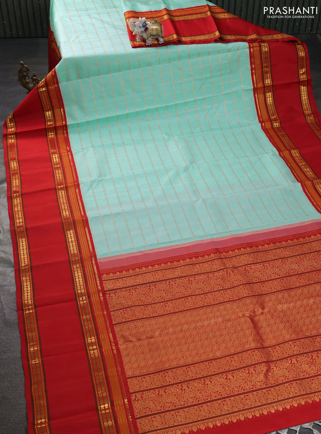 Pure kanchipuram silk saree teal blue and red with allover zari woven checked pattern and long rettapet zari woven border