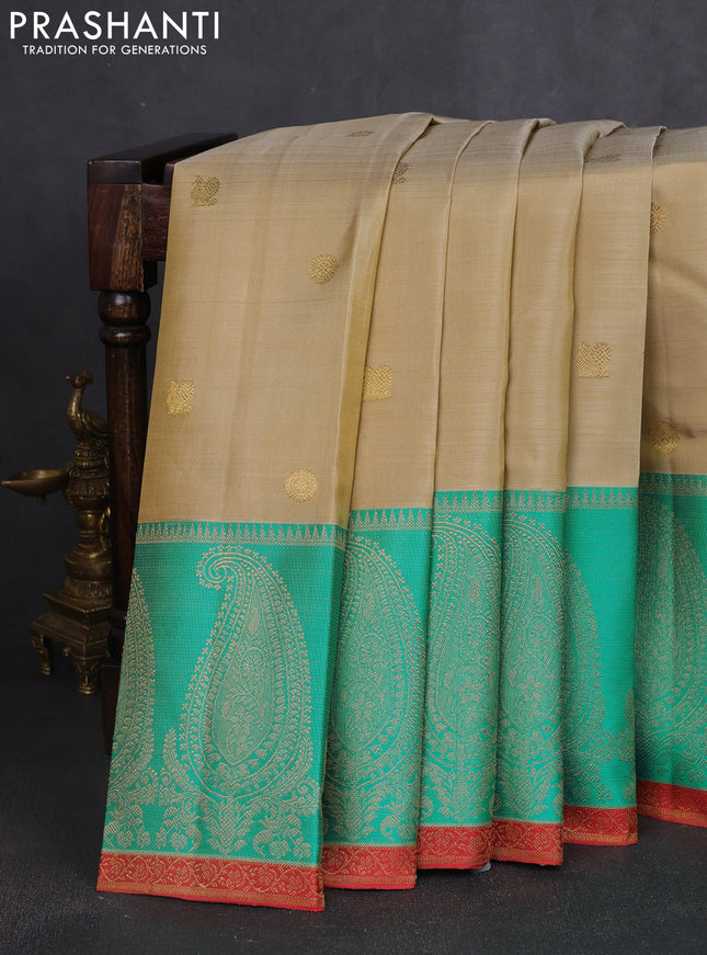 Pure kanchipuram silk saree beige and teal blue with zari woven buttas and long paisley zari woven border