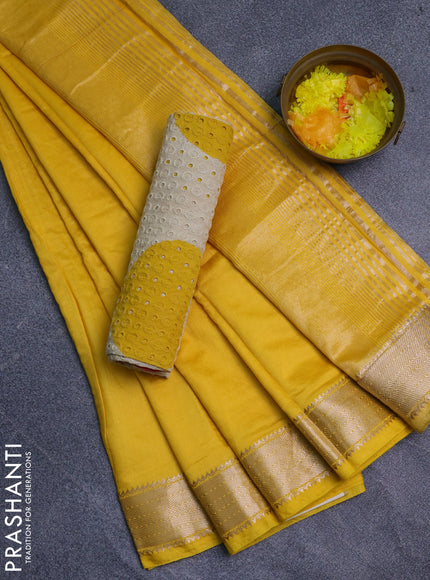 Semi chanderi saree yellow and beige with plain body and zari woven border