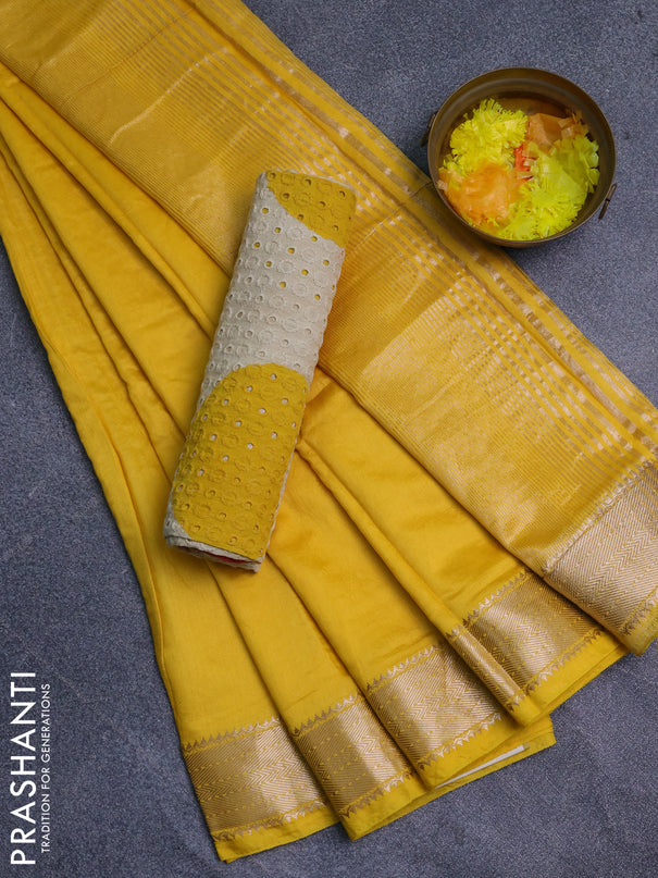 Semi chanderi saree yellow and beige with plain body and zari woven border