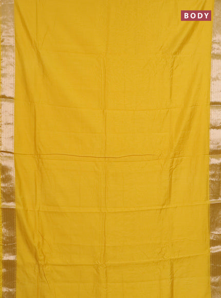 Semi chanderi saree yellow and beige with plain body and zari woven border