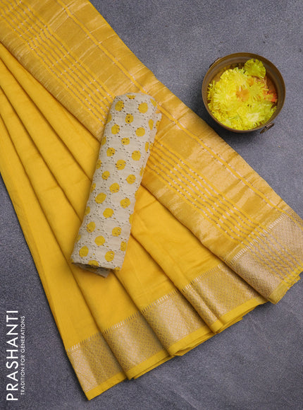 Semi chanderi saree yellow and beige with plain body and zari woven border