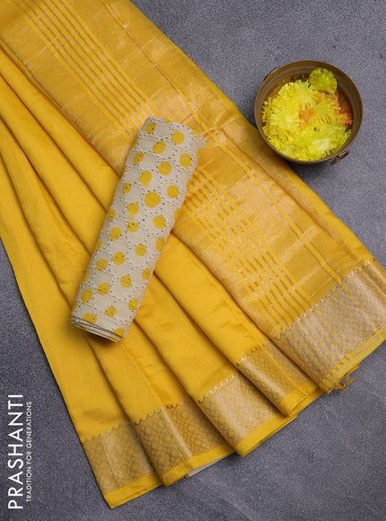 Semi chanderi saree yellow and beige with plain body and zari woven border