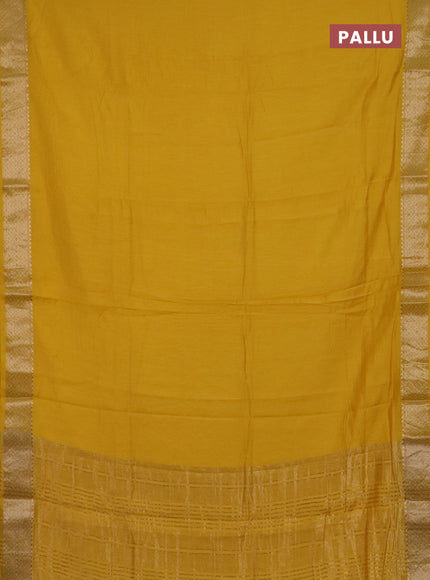 Semi chanderi saree yellow and beige with plain body and zari woven border