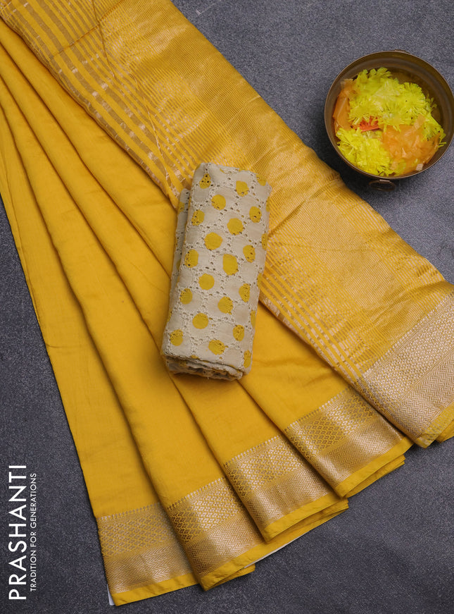 Semi chanderi saree yellow and beige with plain body and zari woven border