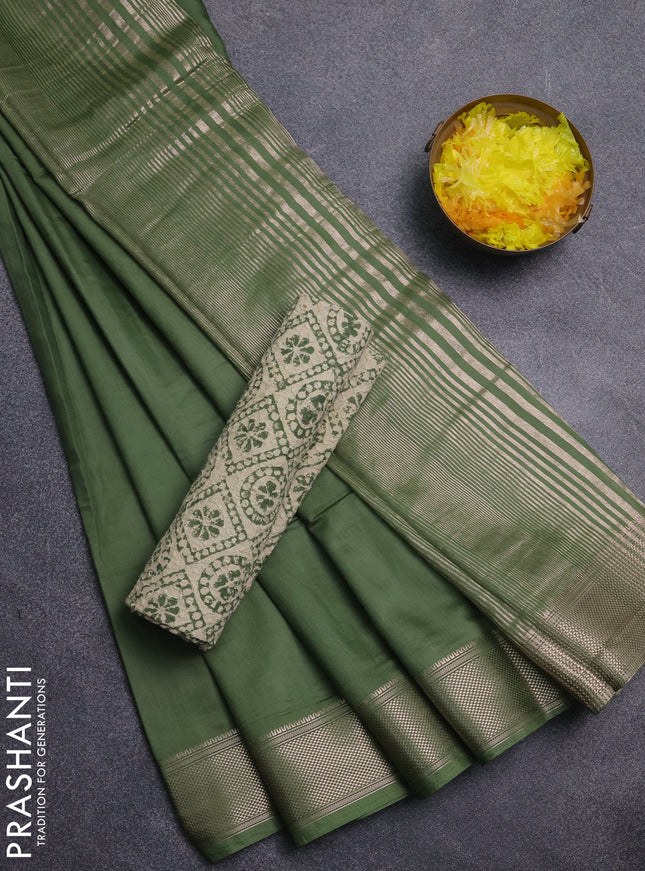Semi chanderi saree sap green and beige with plain body and zari woven border