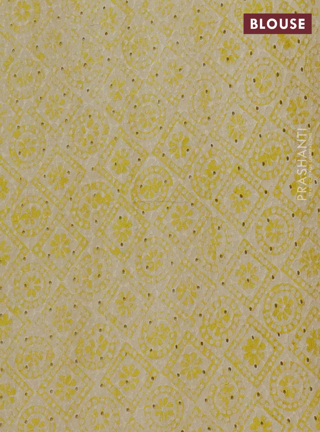 Semi chanderi saree yellow and beige with plain body and zari woven border