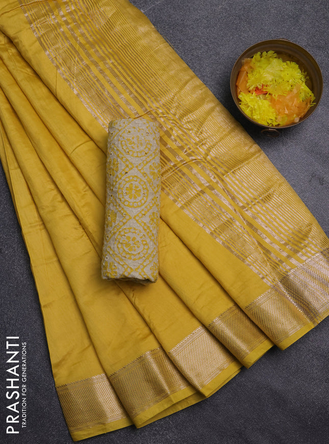 Semi chanderi saree yellow and beige with plain body and zari woven border