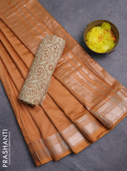Semi chanderi saree dark sandal and beige with plain body and zari woven border