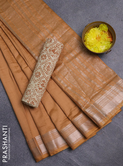 Semi chanderi saree sandal and beige with plain body and zari woven border