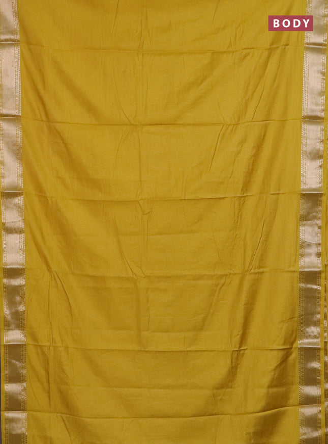 Semi chanderi saree yellow and beige with plain body and zari woven border