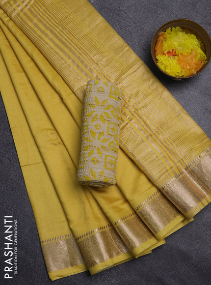 Semi chanderi saree yellow and beige with plain body and zari woven border