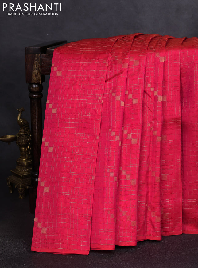 Kanchipuram silk saree dual shade of pinkish orange and mustard yellow with allover zari checks & buttas in borderless style