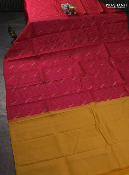 Kanchipuram silk saree dual shade of pinkish orange and mustard yellow with allover zari checks & buttas in borderless style