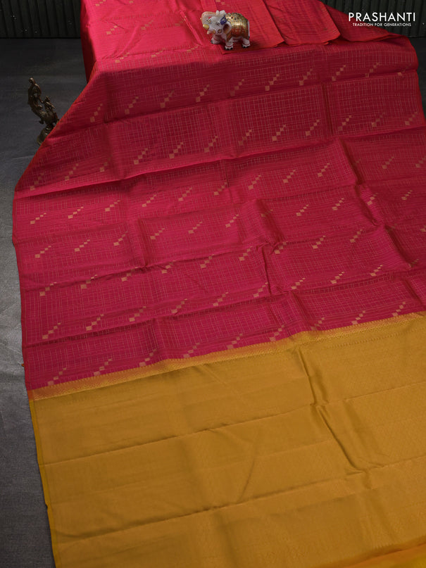 Kanchipuram silk saree dual shade of pinkish orange and mustard yellow with allover zari checks & buttas in borderless style