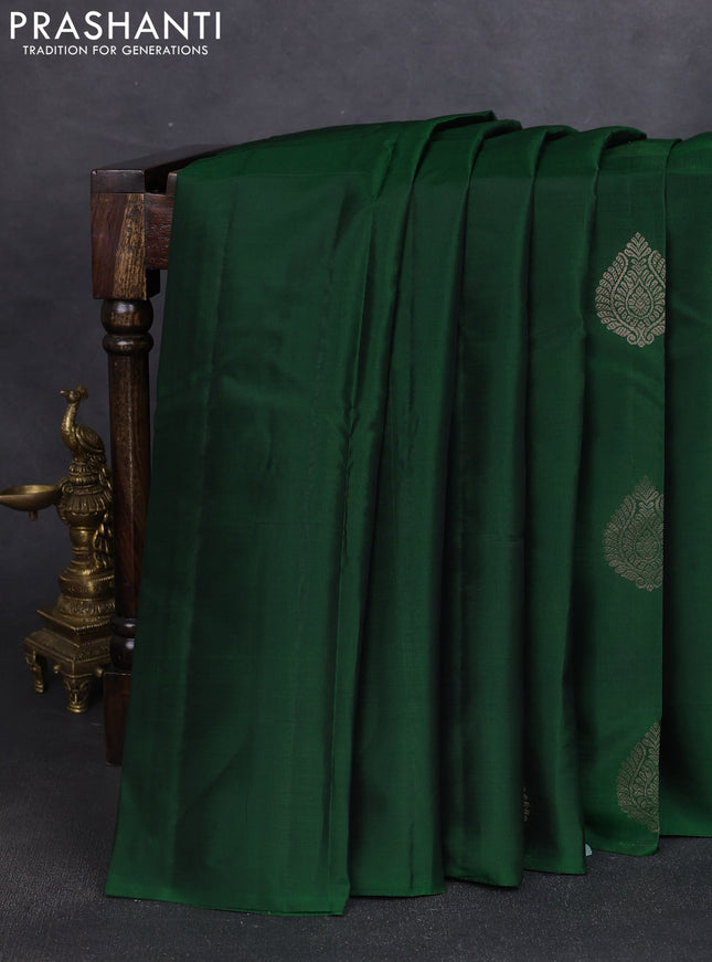 Kanchipuram silk saree bottle green and pink with zari woven buttas in borderless style