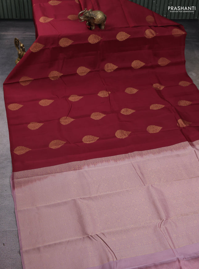 Kanchipuram silk saree maroon and pastel pink with zari woven buttas in borderless style