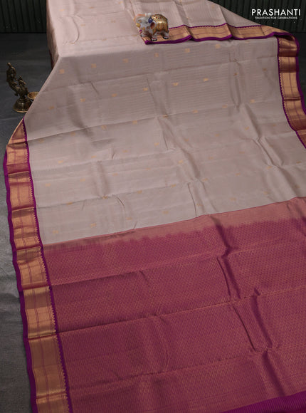 Kanchipuram silk saree beige and purple with allover small zari checks & buttas and rich zari woven korvai border