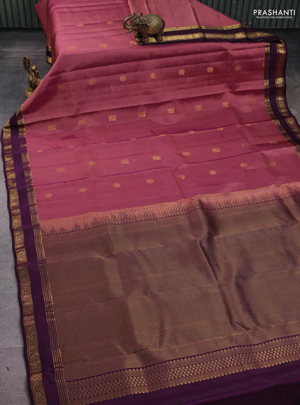 Kanchipuram silk saree dual shade of dark peach and wine shade with zari woven buttas and rettapet zari woven border