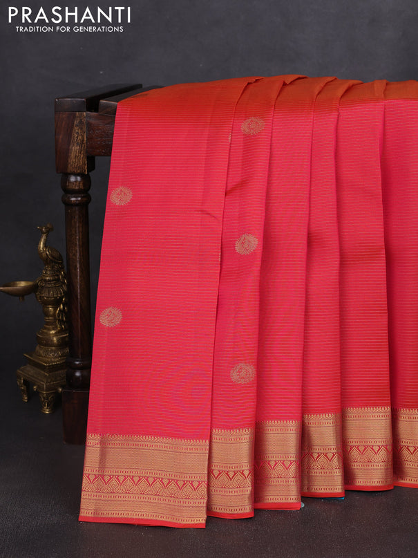 Kanchipuram silk saree dual shade of pinkish orange and teal green with allover zari weaves & buttas and zari woven border