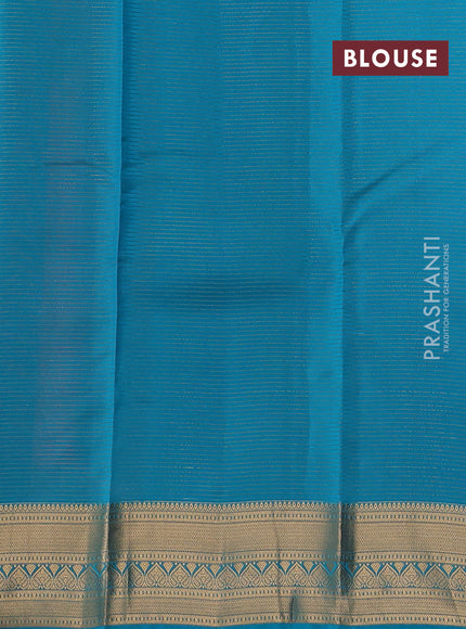 Kanchipuram silk saree dual shade of pinkish orange and teal green with allover zari weaves & buttas and zari woven border