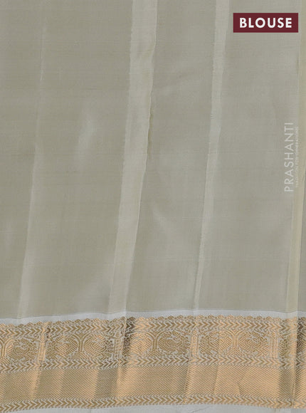 Kanchipuram silk saree dual shade of teal bluish green and cream with allover zari weaves and zari woven korvai border