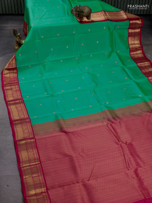 Kanchipuram silk saree teal green shade and pink with zari woven buttas and zari woven korvai border