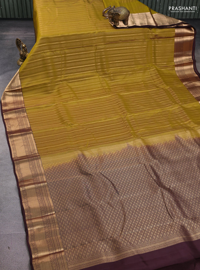 Kanchipuram silk saree mehendi green and brown with allover zari weaves and zari woven border