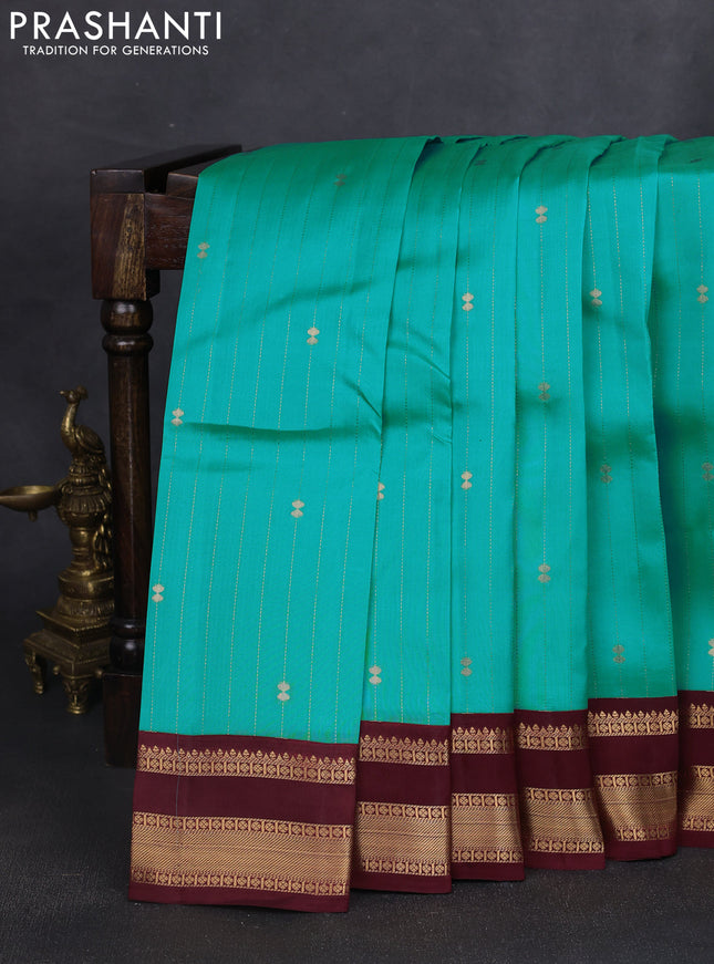 Kanchipuram silk saree teal blue and maroon with allover zari weaves and rettapet zari woven korvai border