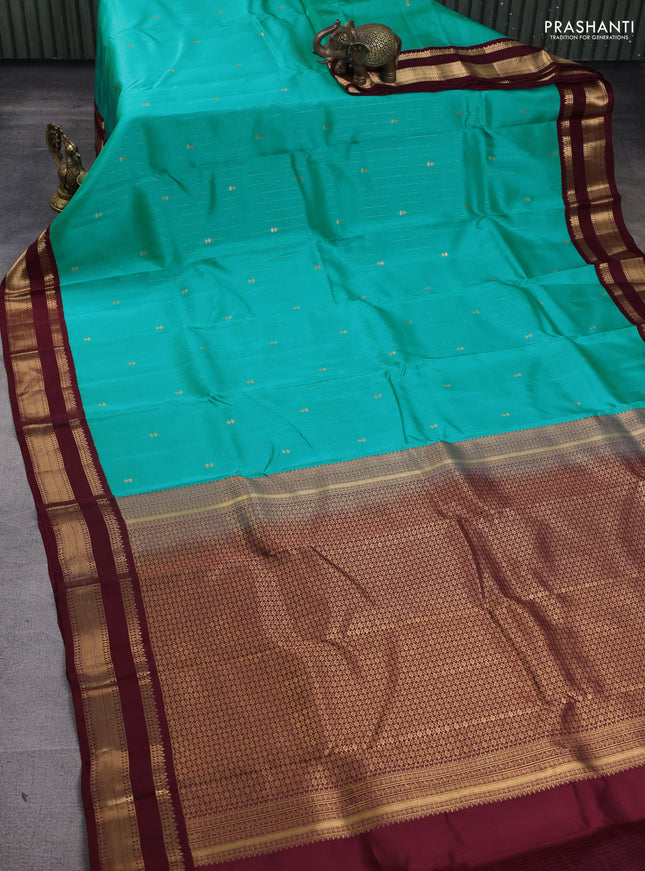 Kanchipuram silk saree teal blue and maroon with allover zari weaves and rettapet zari woven korvai border