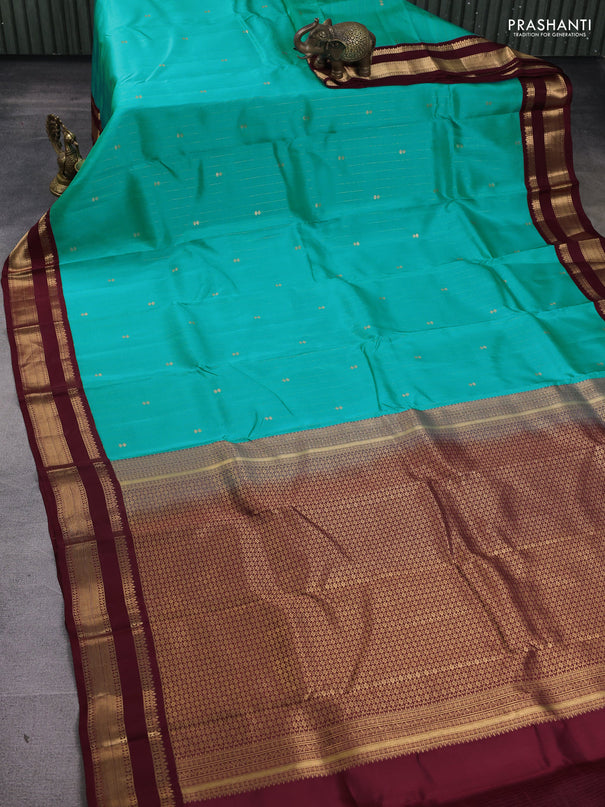 Kanchipuram silk saree teal blue and maroon with allover zari weaves and rettapet zari woven korvai border