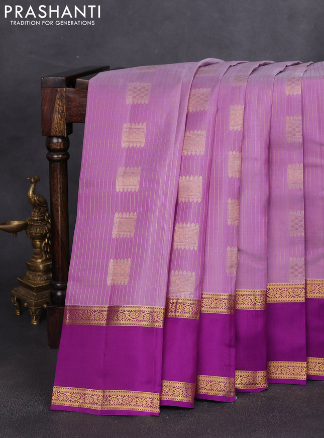 Kanchipuram silk saree lavender and purple with allover zari weaves & buttas and rettapet zari woven border