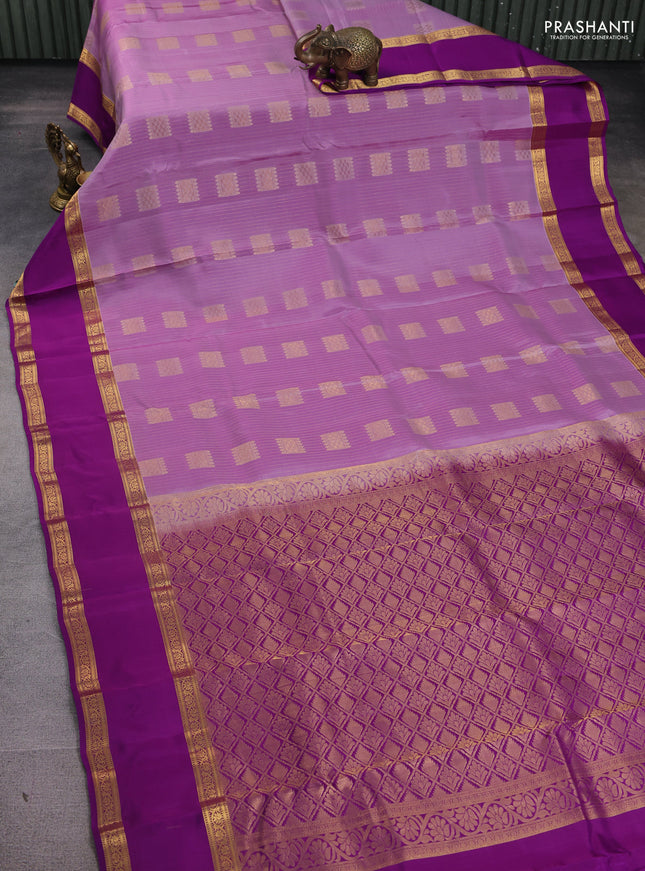 Kanchipuram silk saree lavender and purple with allover zari weaves & buttas and rettapet zari woven border