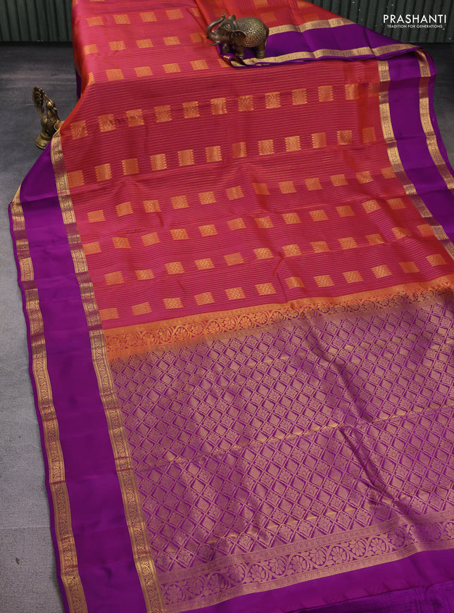 Kanchipuram silk saree dual shade of pinkish orange and purple with allover zari weaves & buttas and rettapet zari woven border