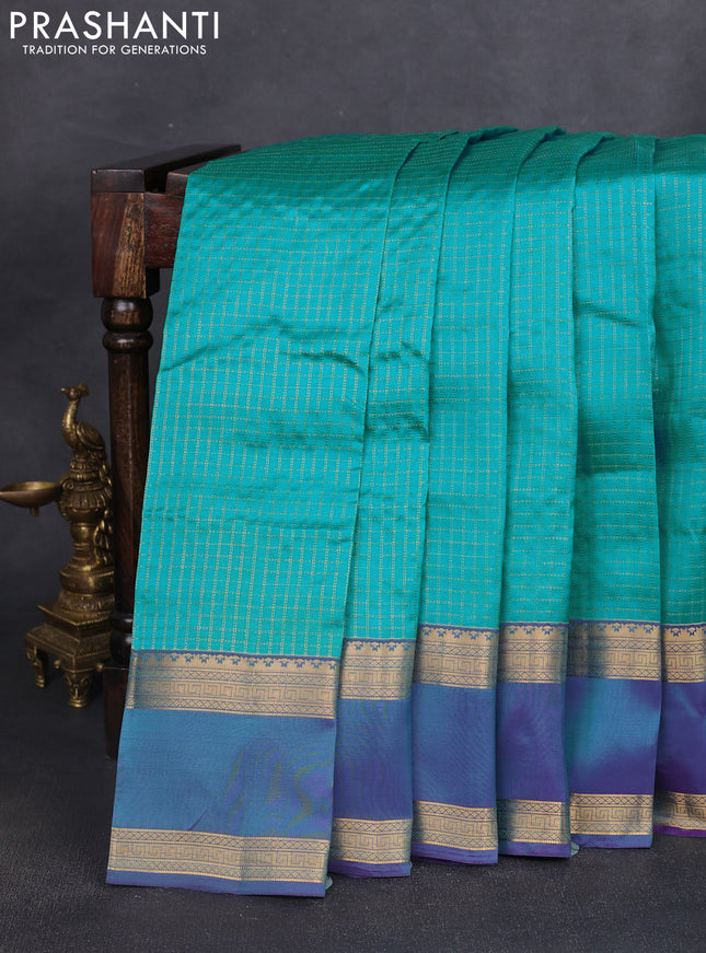 Kanchipuram silk saree teal blue and dual shade of blue witb allover zari woven checked pattern and rettapet zari woven border