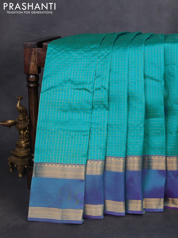 Kanchipuram silk saree teal blue and dual shade of blue witb allover zari woven checked pattern and rettapet zari woven border