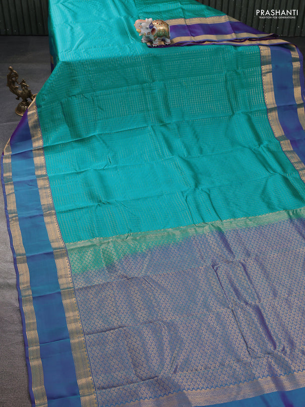 Kanchipuram silk saree teal blue and dual shade of blue witb allover zari woven checked pattern and rettapet zari woven border