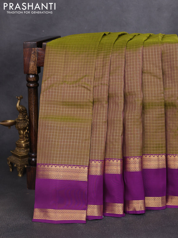 Kanchipuram silk saree dual shade of mehendi green and purple witb allover zari woven checked pattern and rettapet zari woven border