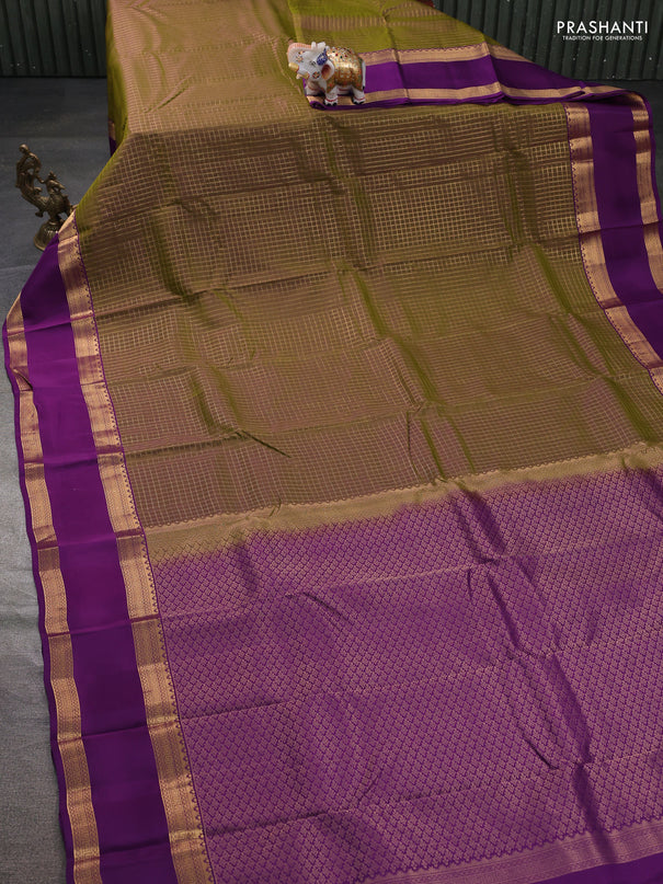 Kanchipuram silk saree dual shade of mehendi green and purple witb allover zari woven checked pattern and rettapet zari woven border