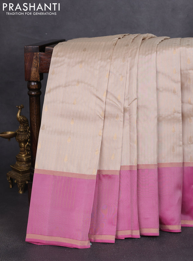 Kanchipuram silk saree beige and pink with allover zari weaves & buttas and zari woven border